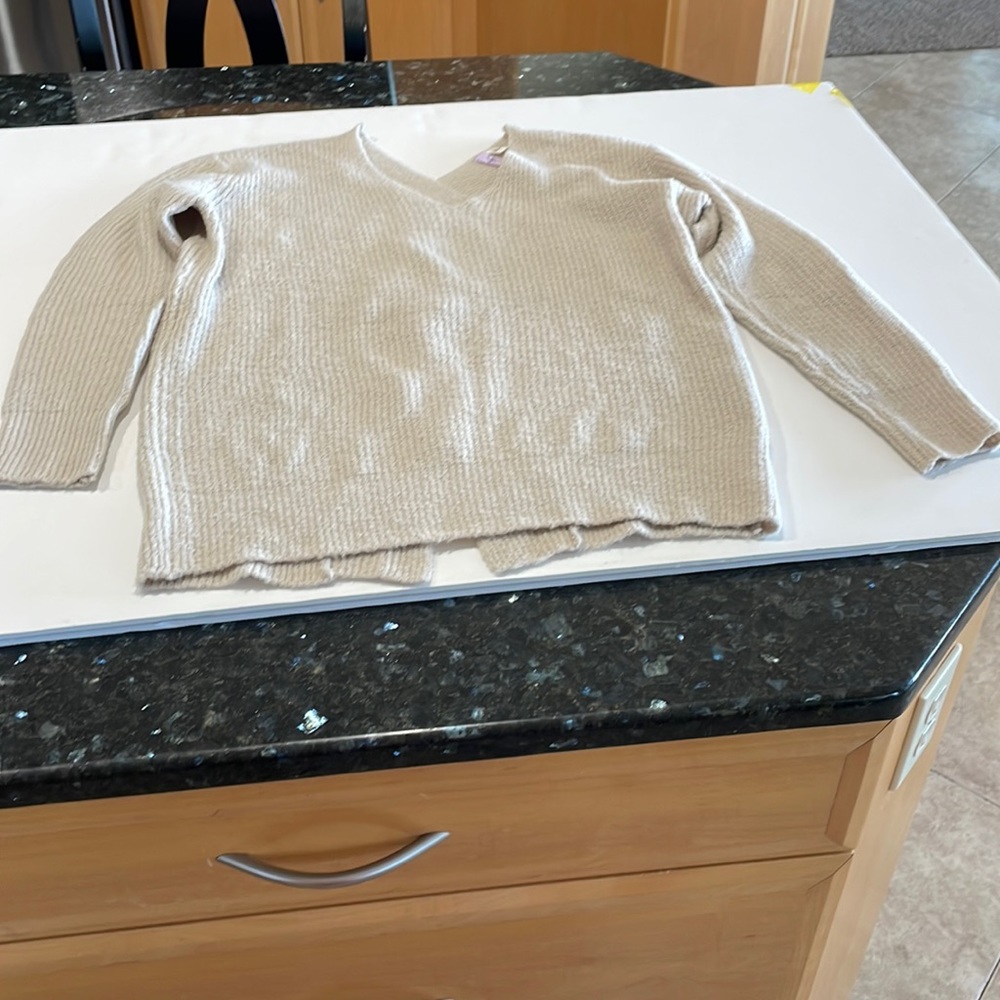 Cream sweater in excellent shape.